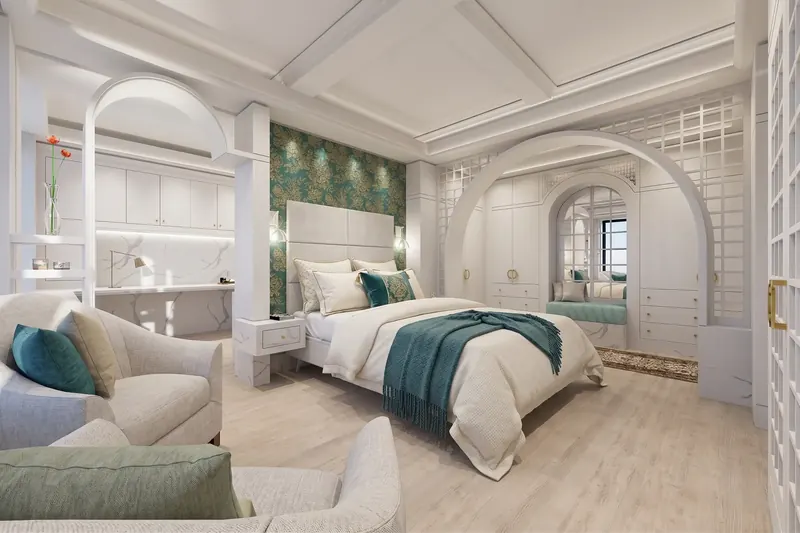 White bedroom with arched openings, lattice screens, teal damask accent wall, coffered ceiling and a window seat