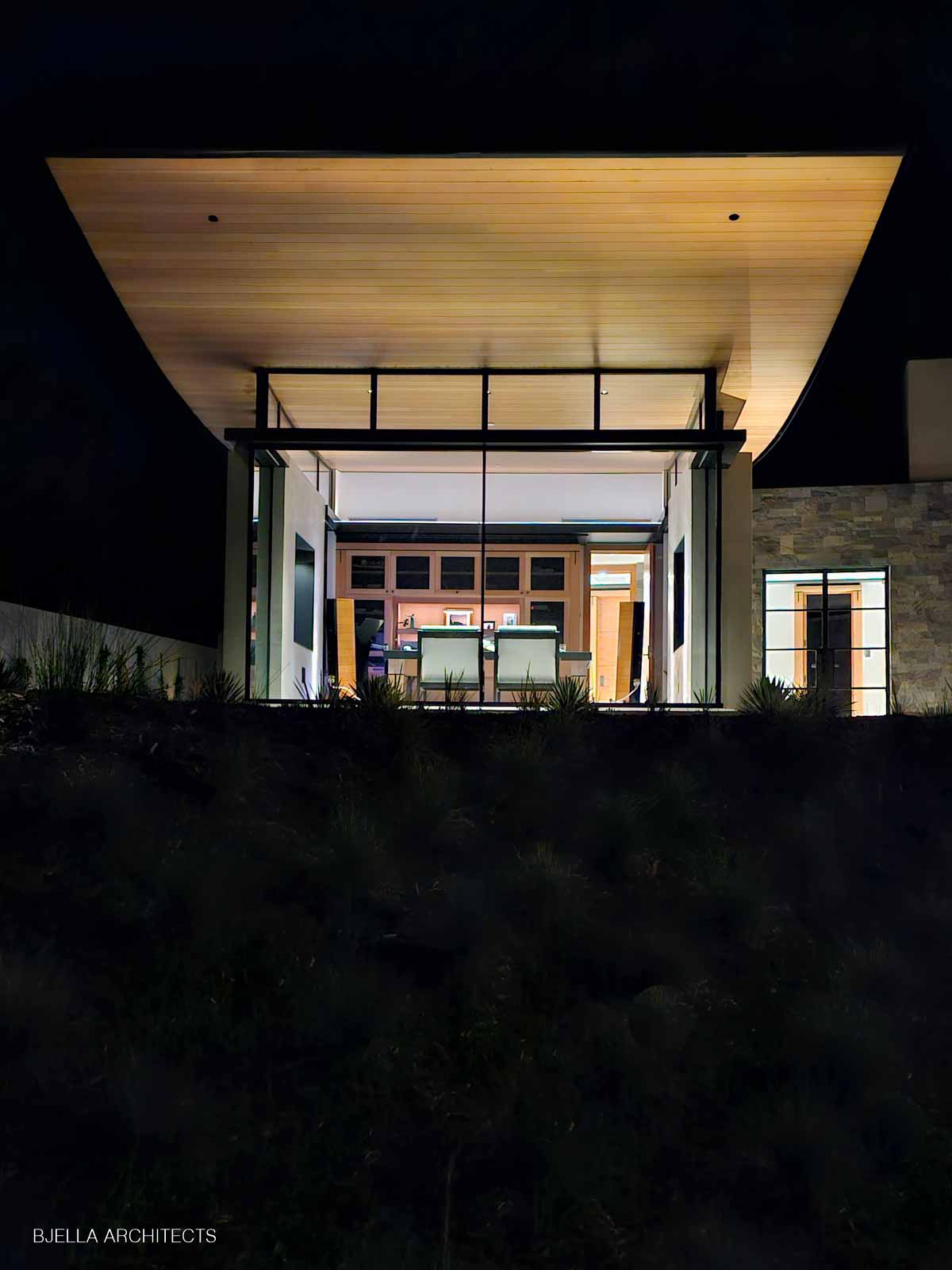 Floating timber canopy at night