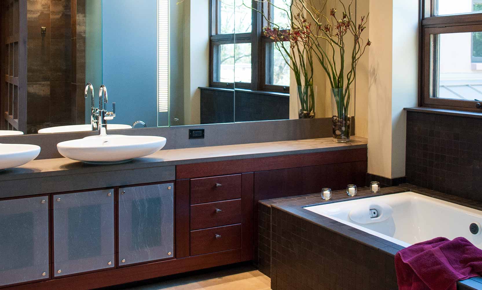 Master bathroom in wood and stone with soaking tub