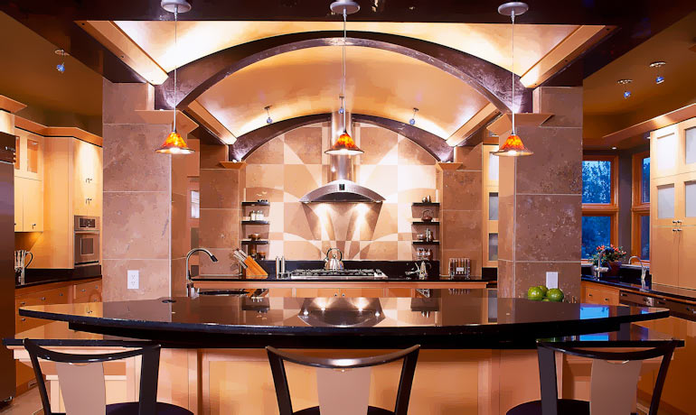 Dramatic kitchen with arched copper ceiling and pendant lighting