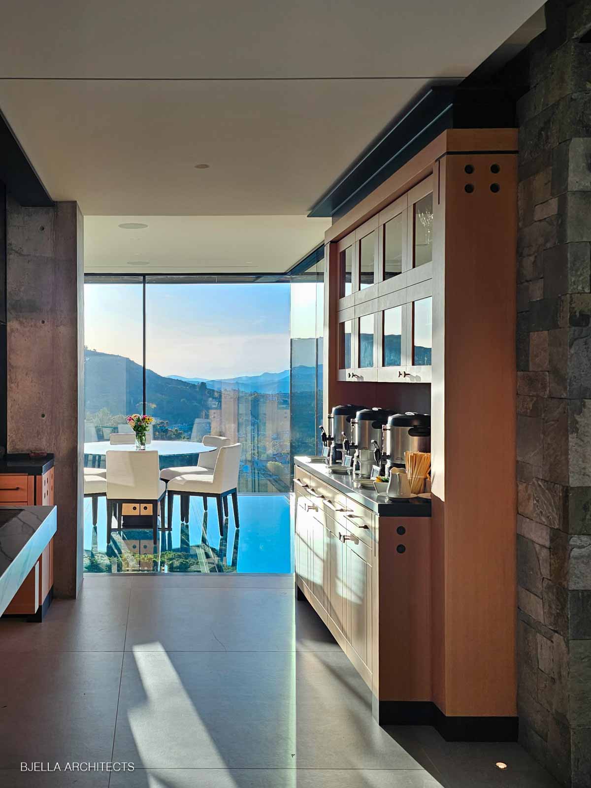 Cabinetry framing the view across the infinity pool