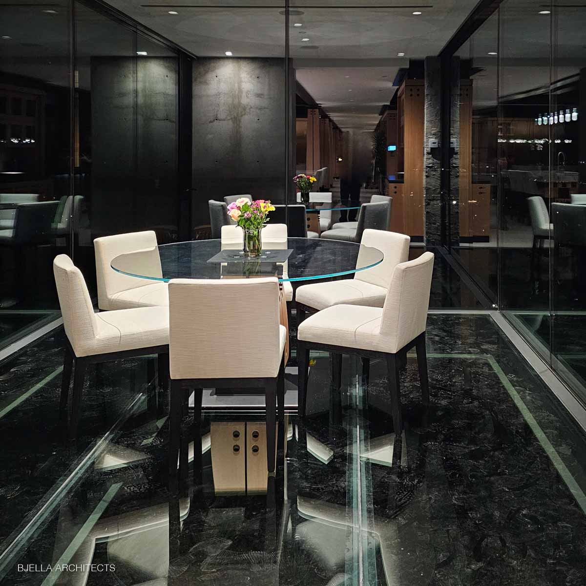 The formal dining room in ebony and glass