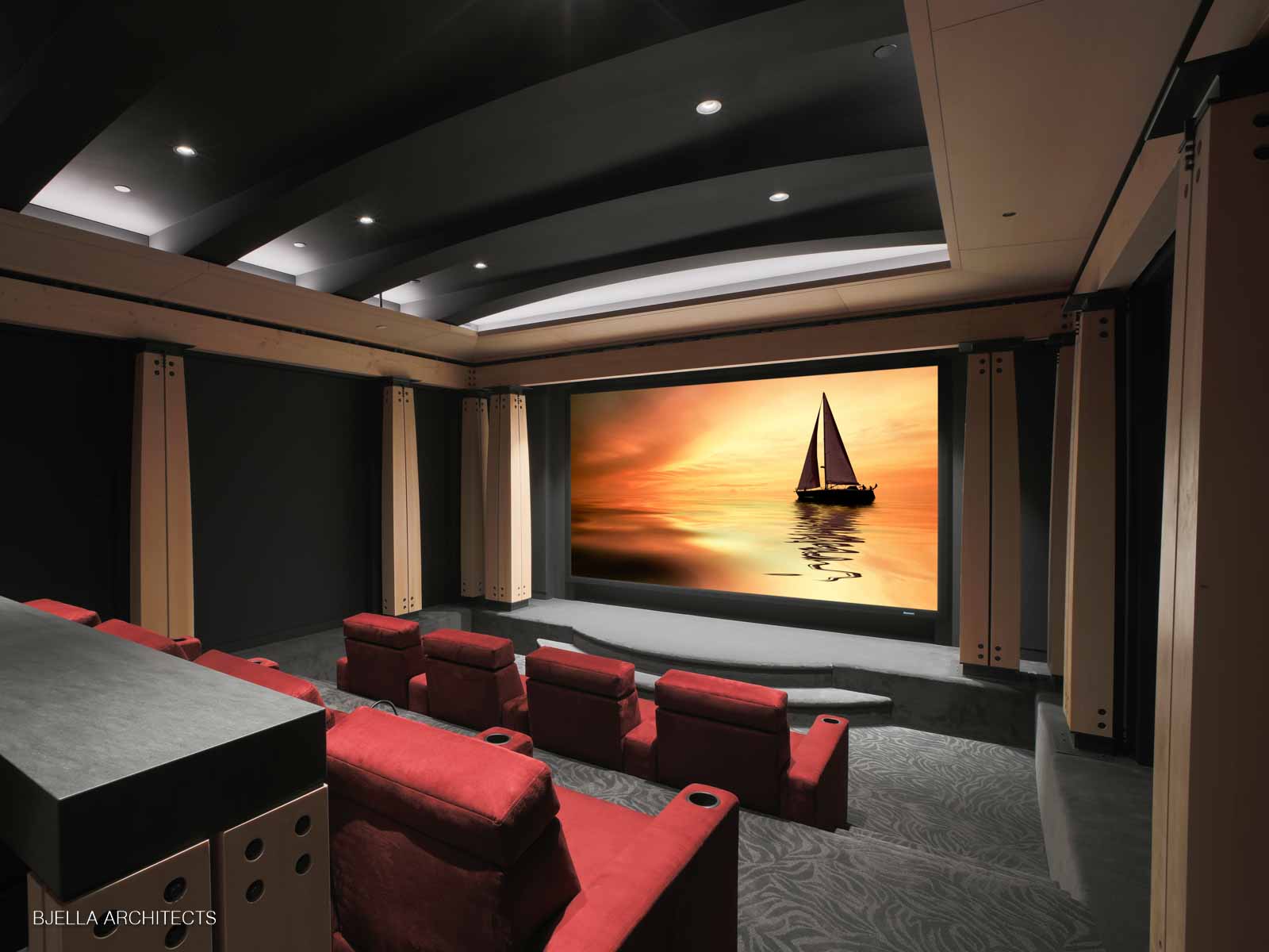 The rear of the theater, warm and quiet
