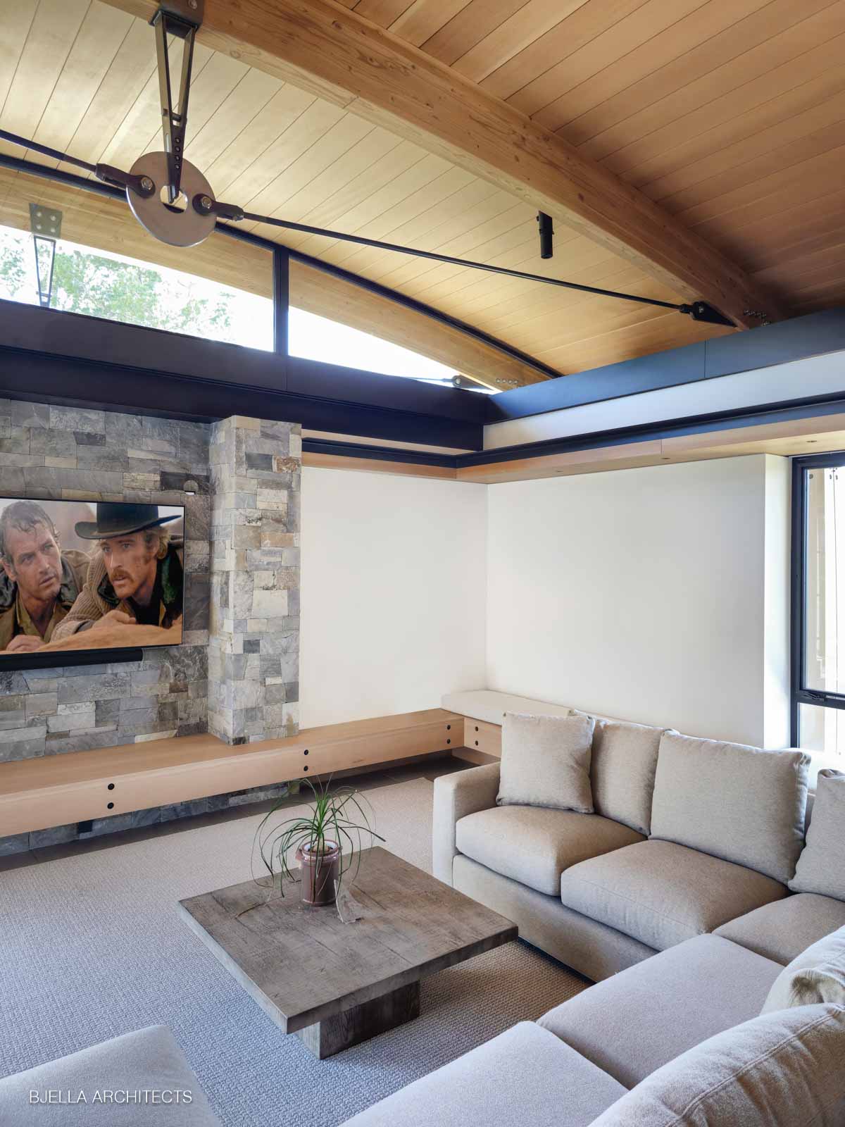 The family room hearth in stone and timber