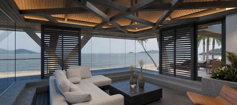 Sunken living room beneath an intersecting wood-beam ceiling, framed by glass walls and louvered screens facing the beach