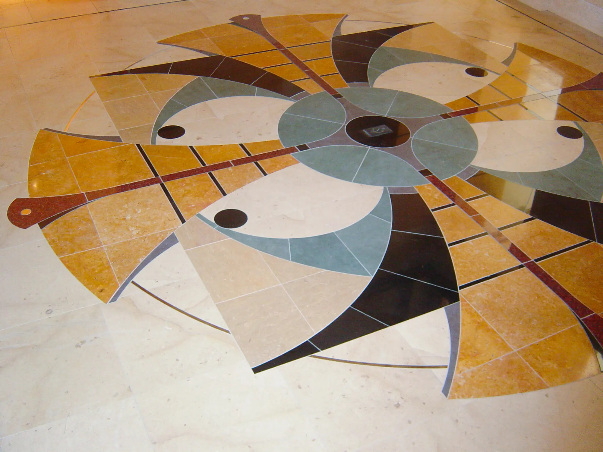 Multi-colored geometric stone medallion in the foyer floor