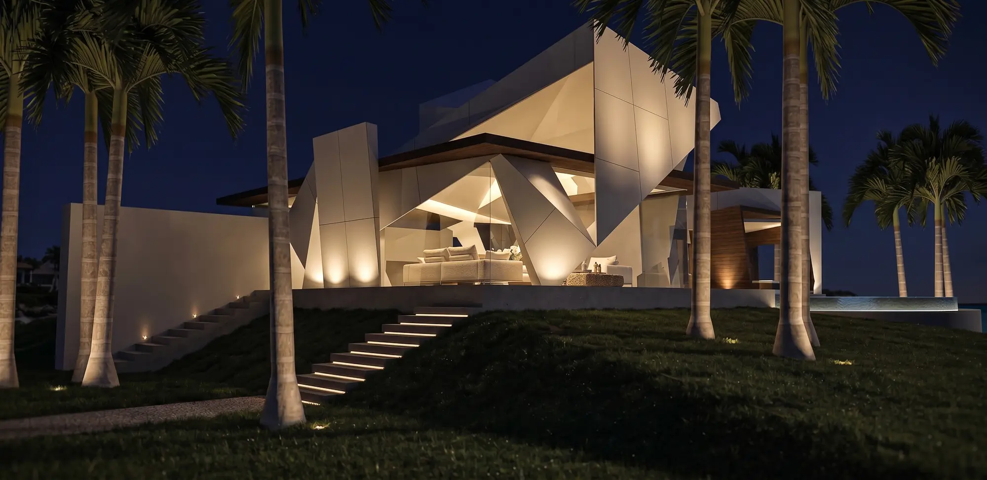 Night view of the illuminated faceted house among palm trees, with lit steps climbing a grassy slope