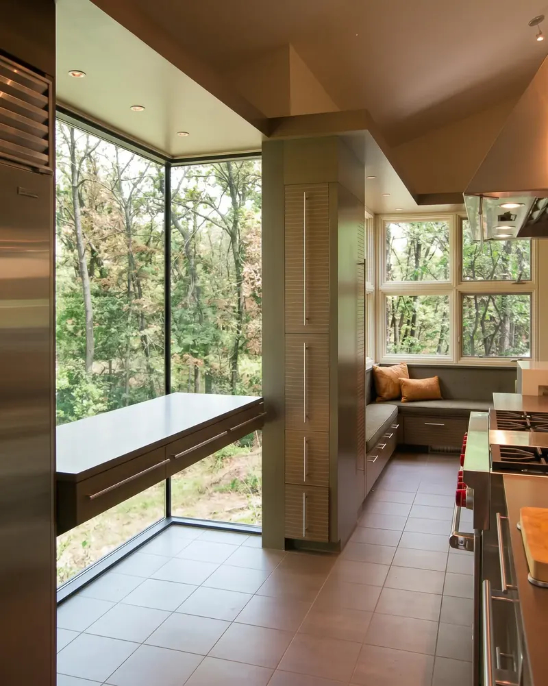 Floating counter in a glass corner overlooking the trees