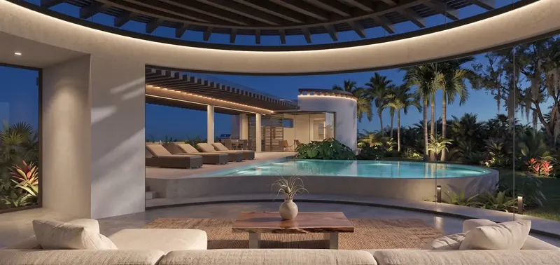 Lanai at dusk beneath a circular trellis, looking over a curved raised pool to loungers, a lit trellis and a second rotunda