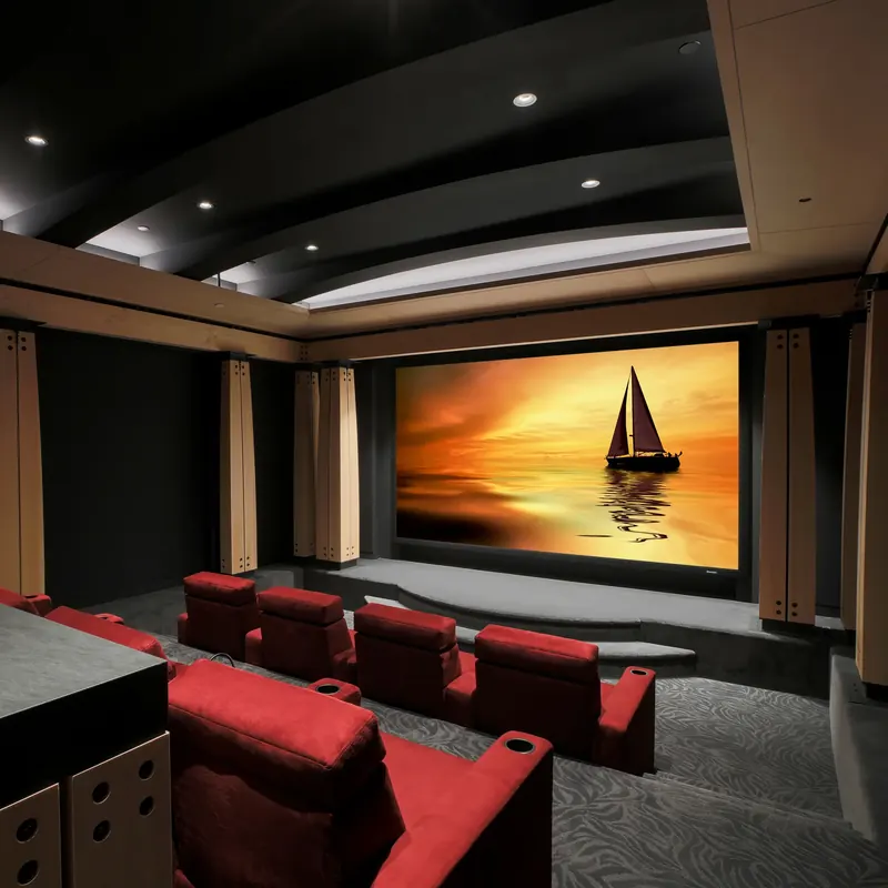 Home theater with red recliners facing a large screen between bolted timber columns
