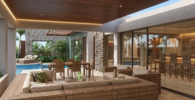 Covered outdoor living room with woven seating and dining table under a wood ceiling, open to the pool, bar behind glass