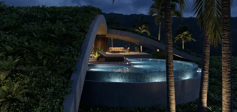 Illuminated circular plunge pool and lounge beneath a concrete arch at night, with dark mountains behind