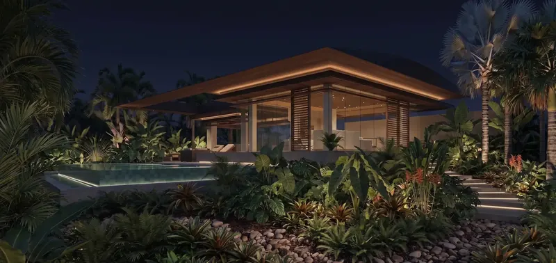 Tropical Light and Shadow House at night, its glass pavilion glowing beneath a wood soffit above a lit pool and garden