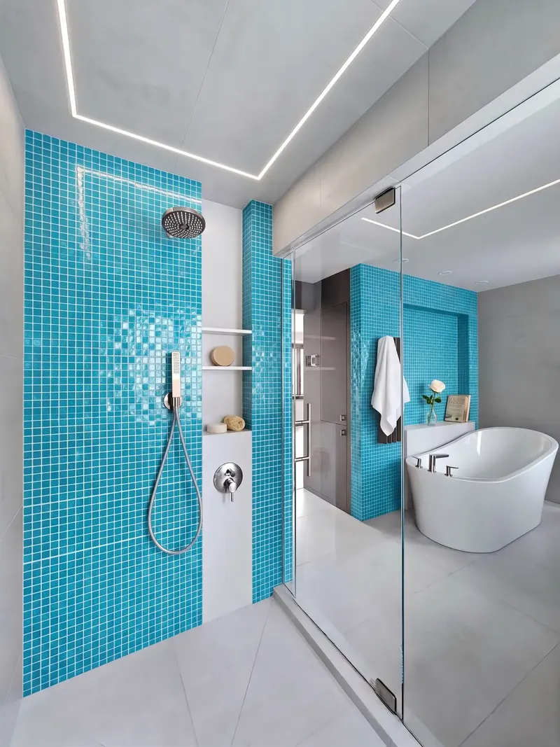 Glass shower with turquoise mosaic tile walls, linear ceiling lights and a freestanding tub, Miami