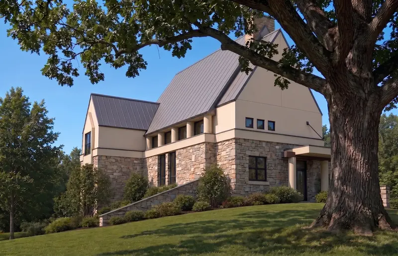 Post-modern house with steep metal roofs and stone base beside a large oak on a sloping lawn, Midwest